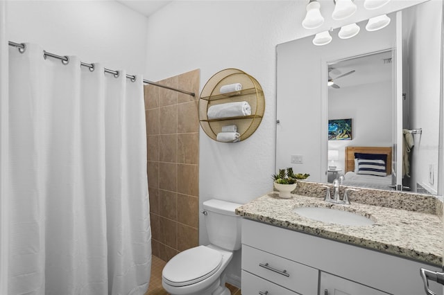 14724 Cherry Blossom Way, Punta Gorda, FL 33955 - bathroom featuring toilet, tiled shower, connected bathroom, and vanity
