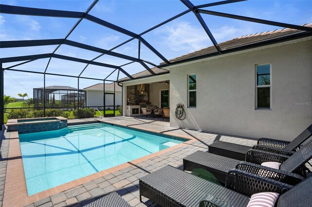 14724 Cherry Blossom Way, Punta Gorda, FL 33955 - view of swimming pool featuring outdoor lounge area, a patio area, a lanai, and a pool with connected hot tub