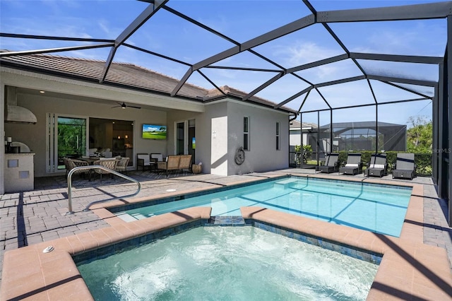 14724 Cherry Blossom Way, Punta Gorda, FL 33955 - view of swimming pool with a patio area, a pool with connected hot tub, glass enclosure, and ceiling fan