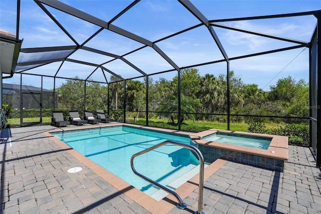 14724 Cherry Blossom Way, Punta Gorda, FL 33955 - view of swimming pool with glass enclosure, a patio area, and a pool with connected hot tub