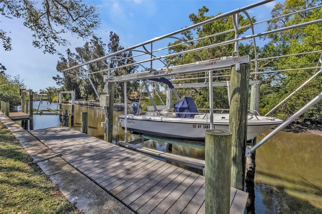 dock area featuring a water view and boat lift