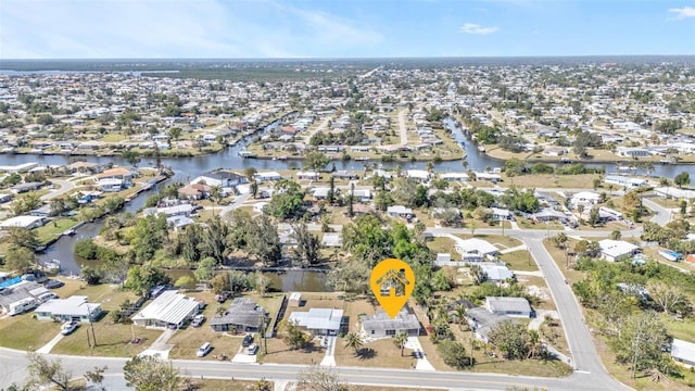 birds eye view of property with a residential view and a water view