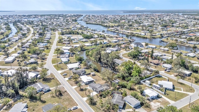 bird's eye view with a water view and a residential view