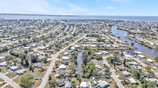 birds eye view of property featuring a water view and a residential view