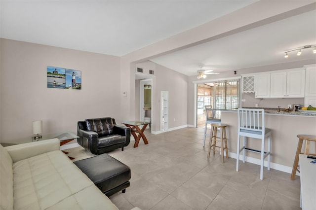 3627 Easy St, Port Charlotte, FL 33952 - living room with a ceiling fan, baseboards, and light tile patterned floors