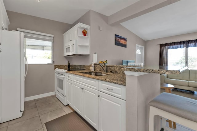 3627 Easy St, Port Charlotte, FL 33952 - kitchen with white appliances, a sink, a peninsula, lofted ceiling, and open shelves