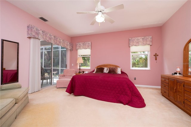 bedroom with light carpet, visible vents, baseboards, ceiling fan, and access to outside