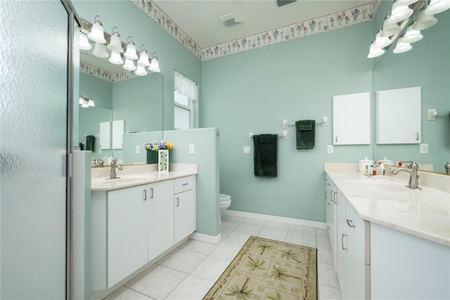 full bathroom with two vanities, a sink, and tile patterned floors