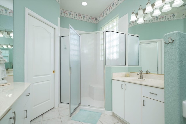 bathroom featuring a shower stall, tile patterned flooring, and vanity