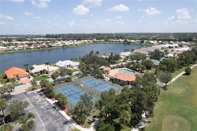 drone / aerial view featuring a water view and a residential view