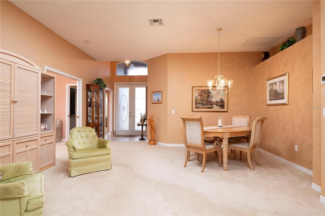 dining space featuring carpet floors, baseboards, visible vents, and a notable chandelier