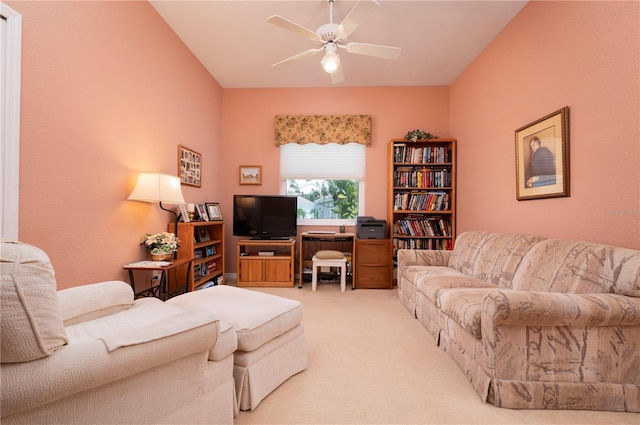 carpeted living room with a ceiling fan