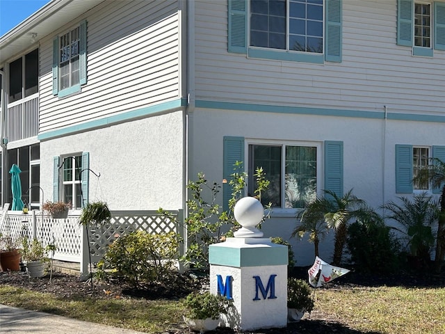 view of side of home featuring stucco siding