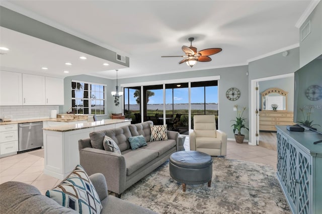 living room with ornamental molding, recessed lighting, visible vents, and light tile patterned floors