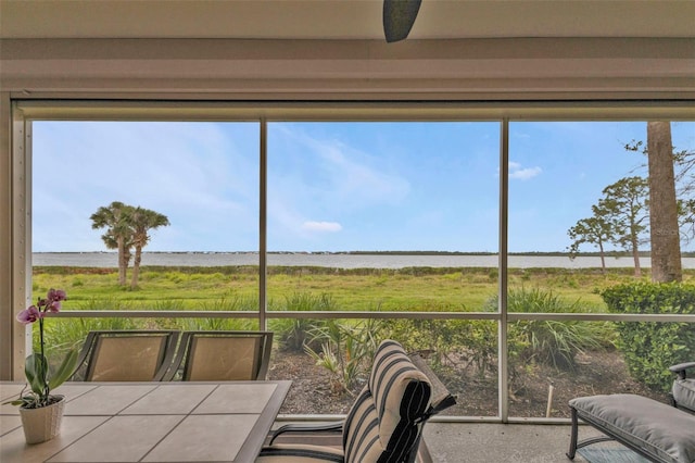 sunroom with a water view