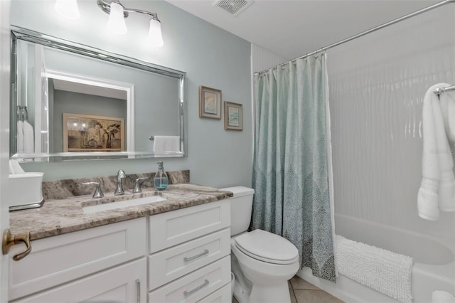 full bath with visible vents, toilet, shower / bath combo with shower curtain, vanity, and tile patterned flooring