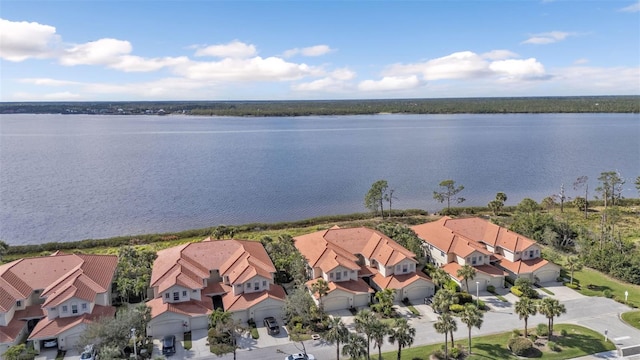 aerial view with a water view and a residential view