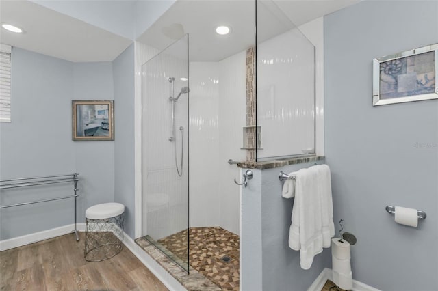 full bathroom featuring recessed lighting, wood finished floors, baseboards, and a walk in shower