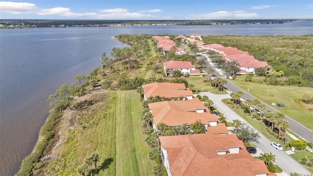 bird's eye view with a residential view and a water view