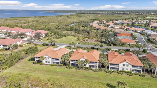 birds eye view of property featuring a residential view and a water view