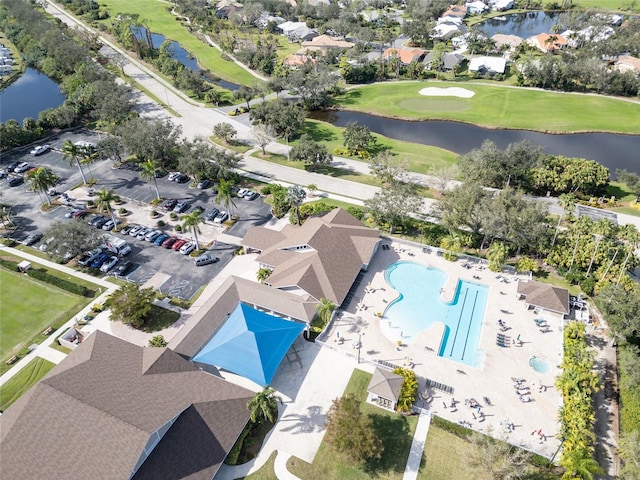 aerial view with view of golf course and a water view