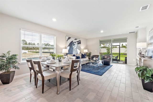 dining area with recessed lighting, visible vents, plenty of natural light, and light wood-style flooring