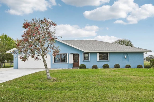 ranch-style home featuring a garage, driveway, a front lawn, and stucco siding