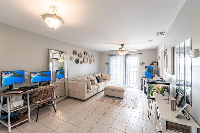 living area with light tile patterned flooring, visible vents, and a ceiling fan