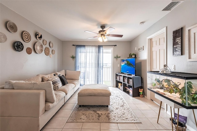 living room featuring visible vents, ceiling fan, and light tile patterned flooring