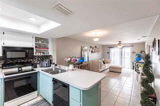 kitchen featuring light countertops, visible vents, white cabinets, a sink, and black appliances