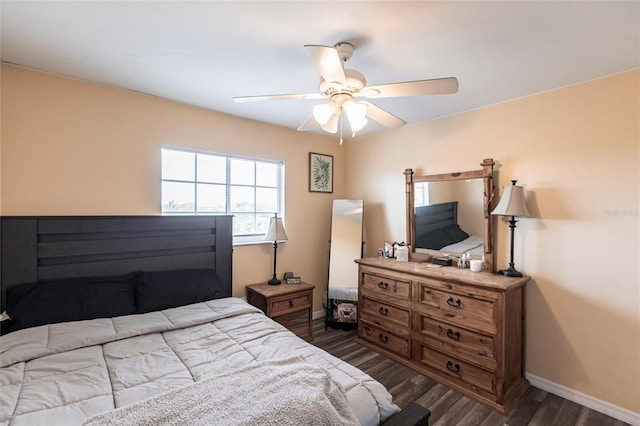 bedroom featuring dark wood-style floors, baseboards, and a ceiling fan