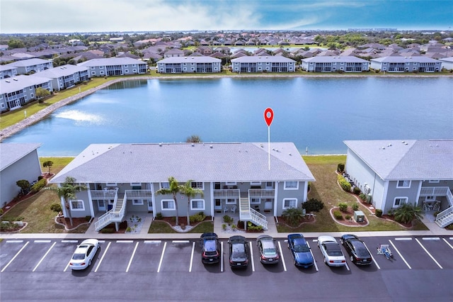 aerial view with a water view and a residential view