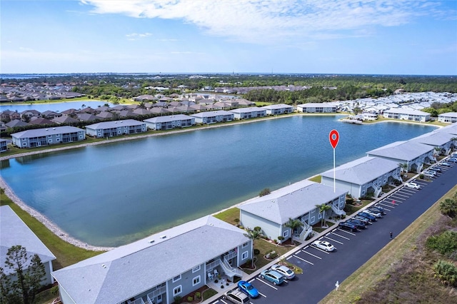 bird's eye view with a residential view and a water view