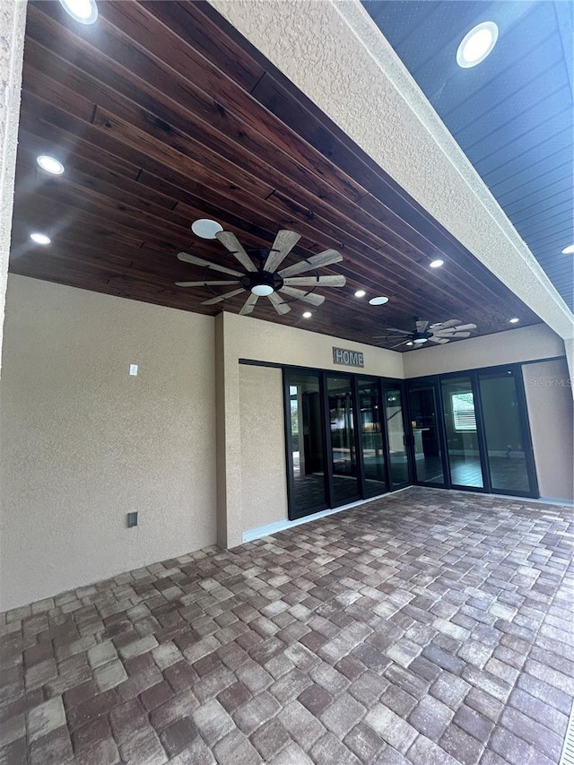 entrance to property with a ceiling fan