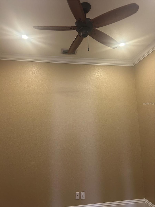 room details with ceiling fan, visible vents, and ornamental molding