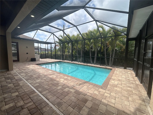 pool featuring a patio area and a lanai