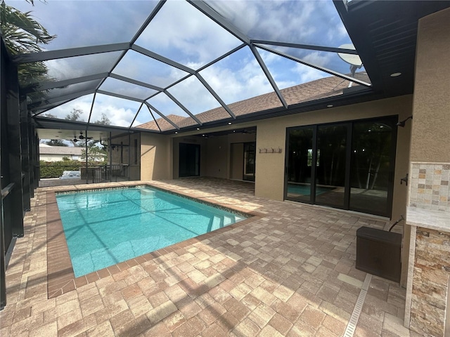 pool featuring a lanai and a patio