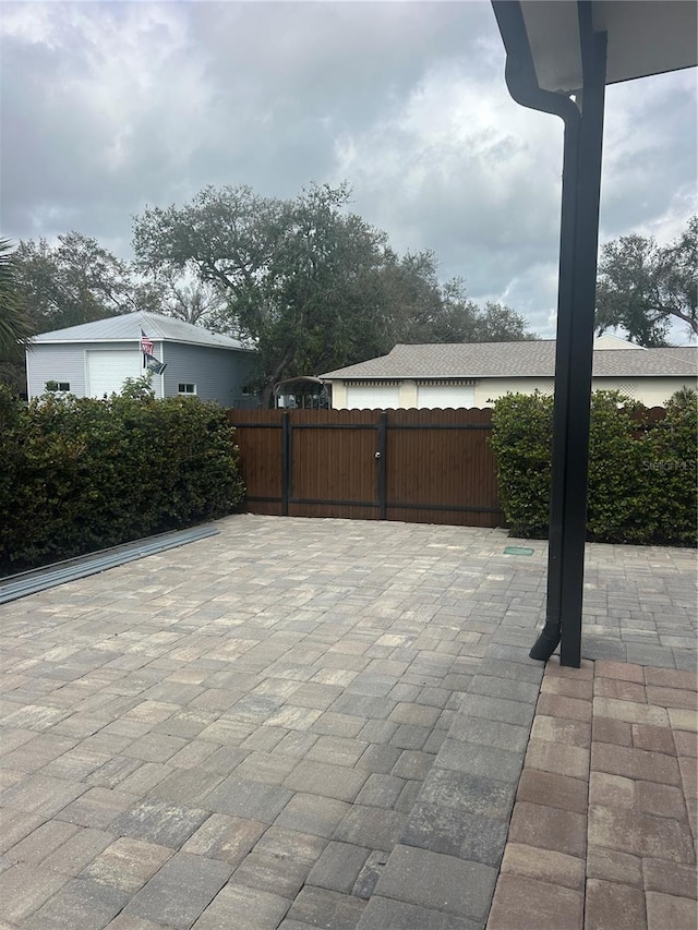 view of patio / terrace featuring fence