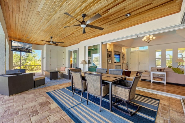 view of patio / terrace with outdoor dining area, ceiling fan, and an outdoor living space