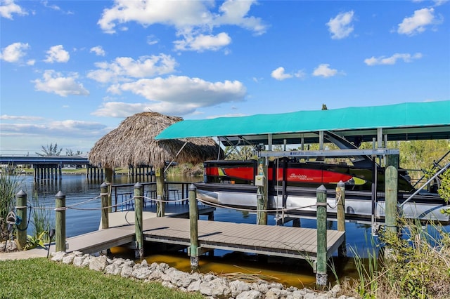 view of dock featuring a water view and boat lift