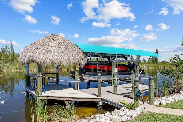 dock area with a water view and boat lift