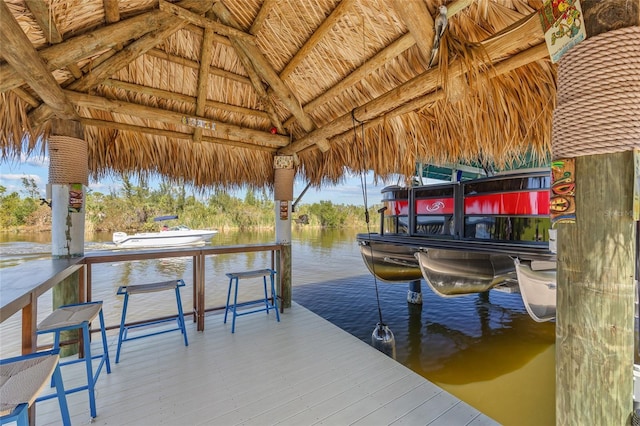 dock area featuring a water view and a gazebo