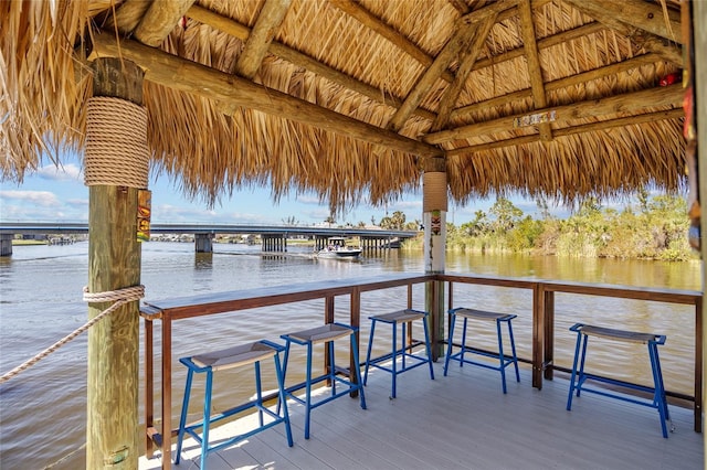 view of dock featuring a water view and a gazebo