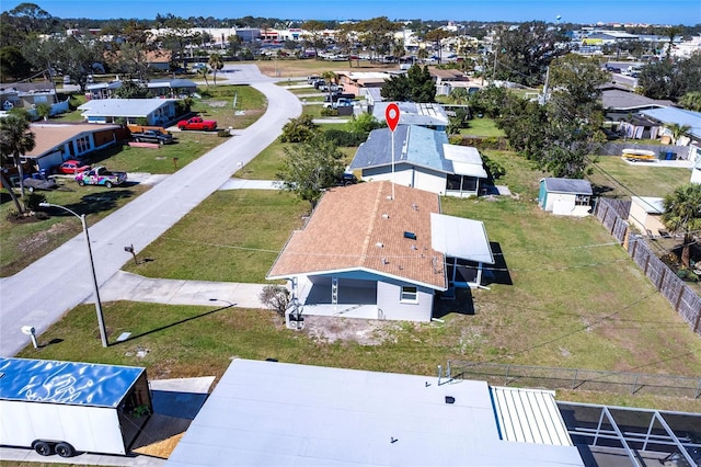 birds eye view of property with a residential view