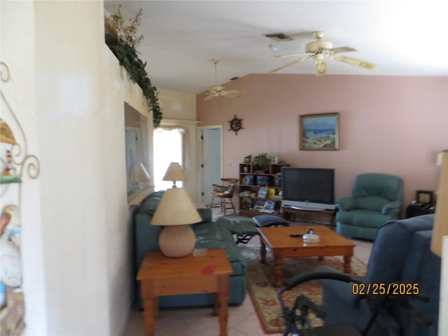 tiled living area with lofted ceiling and ceiling fan