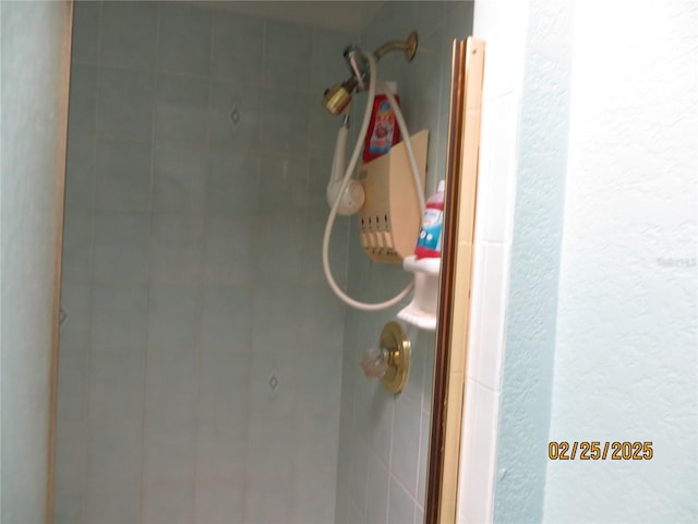 bathroom with a tile shower