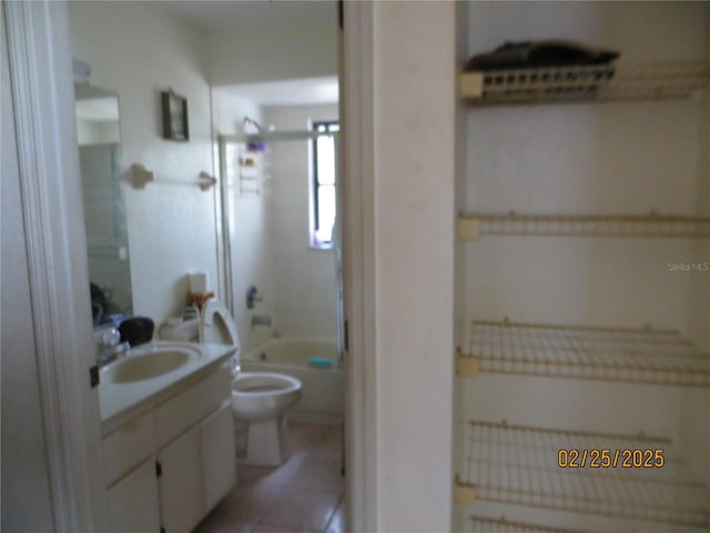 full bathroom with toilet, tile patterned flooring, shower / bathing tub combination, and vanity