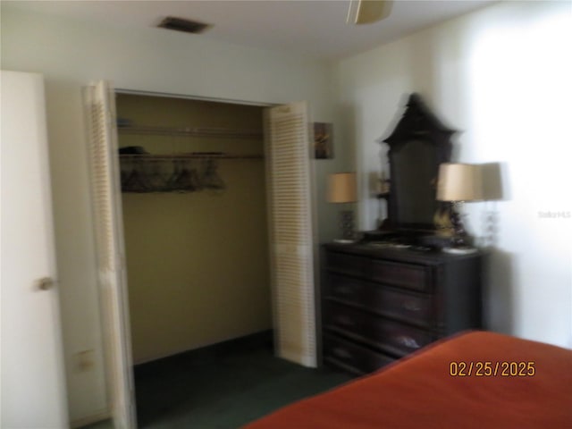 bedroom with visible vents and a closet