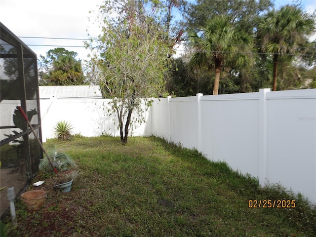 view of yard with a fenced backyard