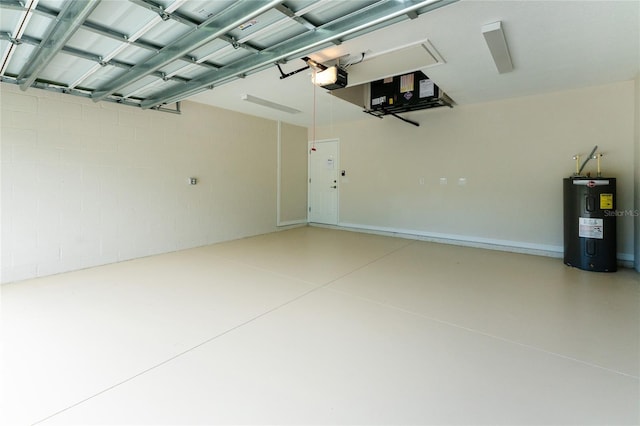 garage with a garage door opener and electric water heater